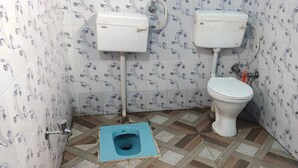 A small bathroom with a toilet, two urinals, and a blue squat toilet. - Hotel Shri Ganesh Hari Ganesh (Ukhimath)