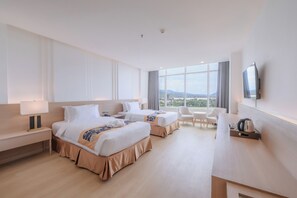 Habitación superior con 2 camas individuales, vistas a la ciudad