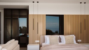 Una camera da letto moderna con un letto, comodini, un divano e vista sull'esterno.