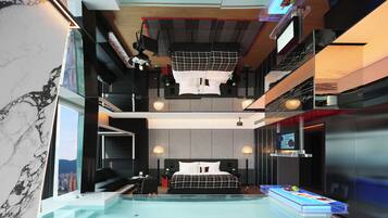 Una habitación de hotel moderna con una cama grande, un escritorio, una silla, una mesita y una zona de piscina.