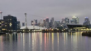 A waterfront cityscape with a prominent bridge and high-rise buildings. - House - Sleeps 2 - Royal Vic Station 5 Mins Walk (London)