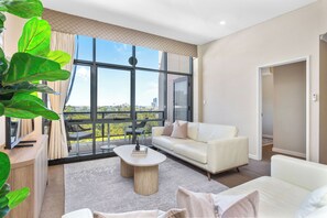 Living area - Experience the perfect blend of urban convenience and natural beauty in this spacious, light-filled 3-bedroom apartment. Situated on the doorstep of Kings Park and the Swan River, this home offers a tranquil retreat right in the heart of Perth. (Perth)