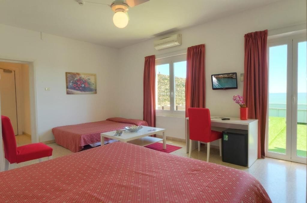 Family Quadruple Room, Balcony, Sea View | In-room safe, blackout drapes, soundproofing, free WiFi