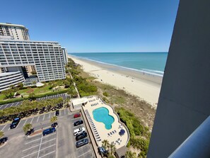 A hotel with a pool, beach view, and parking lot. - South Hampton 1409A Studio Pool & Beach (Myrtle Beach)