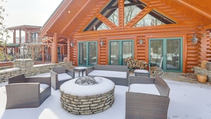 A log cabin with a stone fire pit, outdoor seating, and a covered patio area. - Theater, Gym, Hot Tub: Versailles 'heritage Lodge' (Versailles)