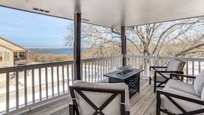 A covered outdoor area with a view of the water, wooden deck, and seating. - 'texoma Shores Hideaway' Family Home w/ Water View (Pottsboro)