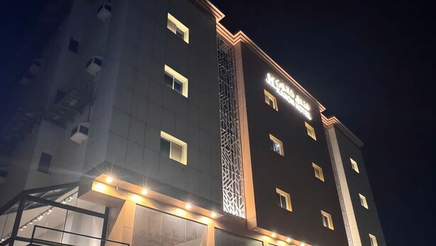 A hotel with a modern facade, featuring illuminated signage and a prominent entrance. - KANON Hotel Makkah  (Makkah)