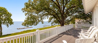 Waterfront home with scenic porches, yard, grill, jetted tub, central AC, & W/D