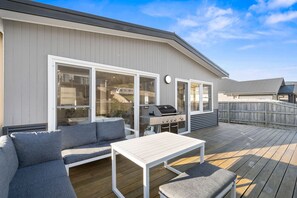 A deck with a barbecue, outdoor seating, and a view of the backyard. - Days by the Bay (Apollo Bay)