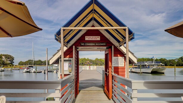 A covered dock with a sign prohibiting fuel and crabbing. - 4 Beachside Home - Pet Friendly - Coastal Comfort Meets Stylish Island Living (Hilton Head Island)