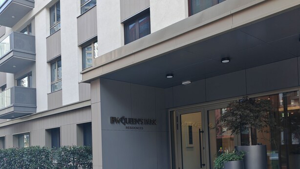A modern building with a sign reading 'BW Queen's Park Residences.' - Belgrade Waterfront Lux 3  (Belgrade)