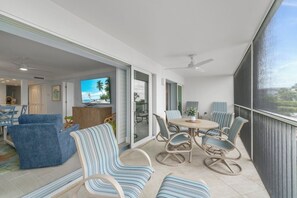 Outdoor dining - White Sands #15 A stunning Beach Front 2 bedroom, 2 bathroom condo. (Sanibel)