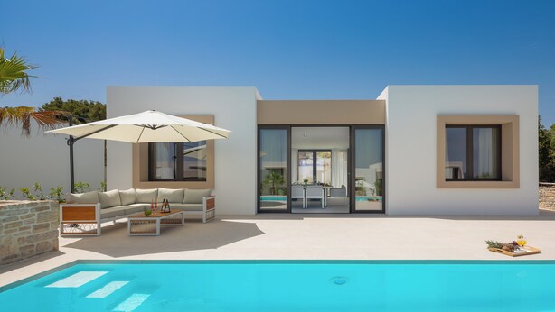 A modern house with a swimming pool, outdoor seating, and a glass door leading to a patio. - The Palms Resort 2BR Villa Dream Four with Pool (Tkon)