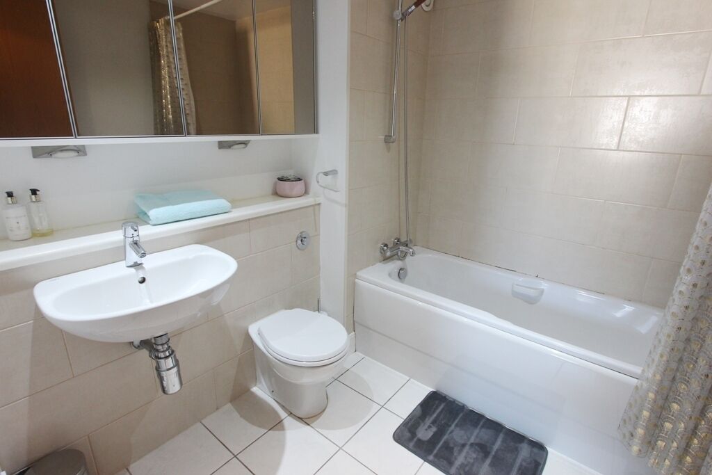Shower, hair dryer, towels, toilet paper