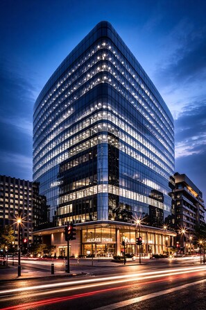 A modern hotel with a curved facade, large windows, and a prominent entrance. - Luxury 3BR flat in Central London (London)