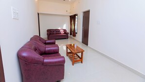 A living room with a sofa set, a coffee table, and a ceiling fan. - Welcome Grand Private Pool Villa (Vanur)
