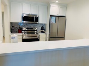 Fridge, microwave, oven, stovetop - Gulf Side Villa 1A - Gulf front Pet Friendly -Free Daily Activities (Pensacola)