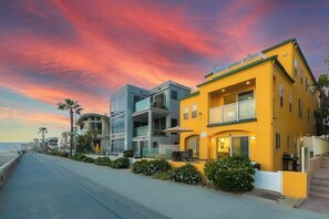 A coastal hotel with modern architecture, featuring balconies and a view of the sea. - Amazing for Families, Oceanfront, Stunning Views W Parking! (San Diego)