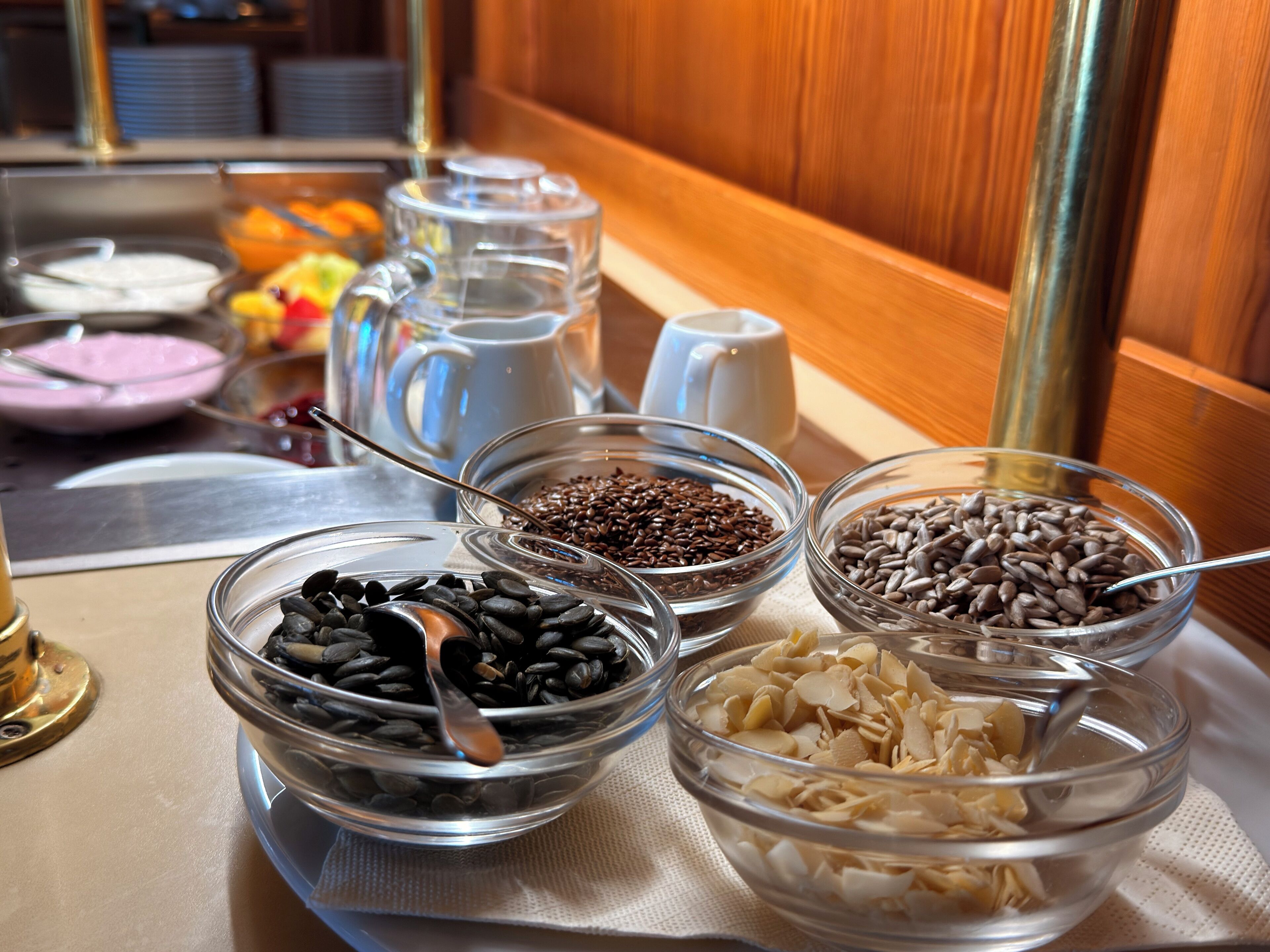 A breakfast buffet with various food items and a coffee machine.