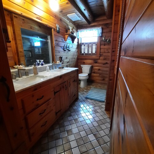 A peaceful getaway awaits at this beautiful Log Home located on Sodus Bay