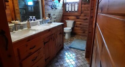 A peaceful getaway awaits at this beautiful Log Home located on Sodus Bay