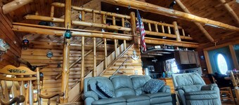 A peaceful getaway awaits at this beautiful Log Home located on Sodus Bay