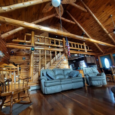 A peaceful getaway awaits at this beautiful Log Home located on Sodus Bay