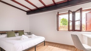 A bedroom with a bed, a desk, and a window with an open shutter. - InfinityCoast 3 byFidalsa (Piélagos)