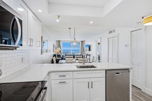 Fridge, microwave, oven, stovetop - New Reno Gulf-Front 3 Bedroom Condo | Heated Pool & Hot Tub | Sand Castle I (Indian Shores)