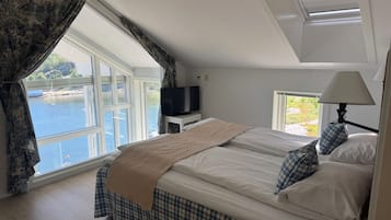 Apartemen Deluks | Tirai kedap cahaya, setrika/meja setrika, Wi-Fi gratis, dan seprai linen