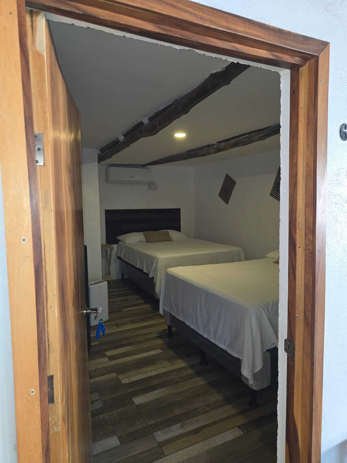 Deluxe Double Room, 2 Double Beds, Air conditioning, Partial Sea View | Blackout drapes, free WiFi, bed sheets