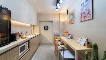 Mini-fridge, microwave, cookware/dishes/utensils