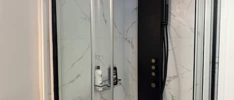 Shower, towels, soap, toilet paper