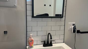 Shower, towels, soap, toilet paper