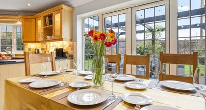 Six bedrooms, games room, firepit garden and sweeping field views