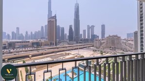A view of a city skyline with prominent skyscrapers, including a very tall building. - Vogue | Downtown with Direct Access to Dubai Mall (Dubai)