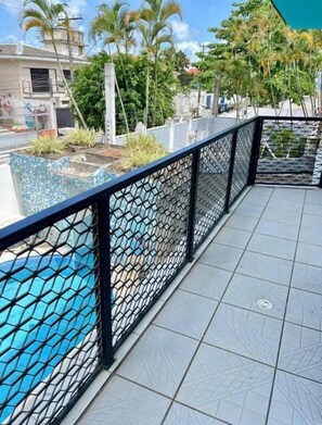 Family Room, Balcony, Pool View | Property grounds - Santa Rita Pousada (Guarujá)