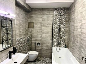 A modern bathroom with a shower, toilet, and bathtub. - Contemporary Wood Haven | Center (Karlovy Vary)