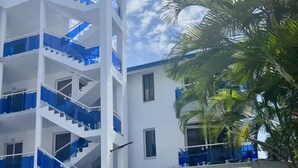 A poolside view with a building featuring multiple balconies and a clear sky. - Double Room 300 at the Hotel Legendario (Sosúa)