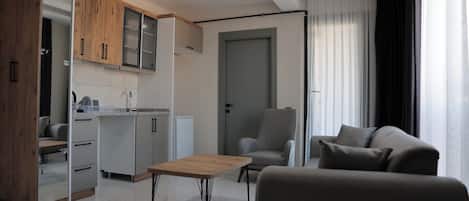 Suite Deluxe, balcón, vistas al mar | Zona de estar