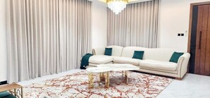 Living area - Spacious 4-bedroom villa in serene Ajman with AC comfort (CH8X+4C9 - Al Zahya - Ajman)