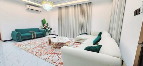 Spacious 4-bedroom villa in serene Ajman with AC comfort