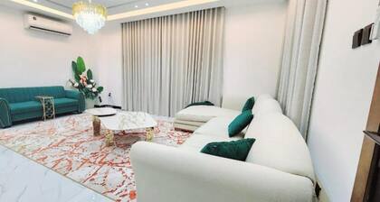 Spacious 4-bedroom villa in serene Ajman with AC comfort