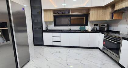 Spacious 4-bedroom villa in serene Ajman with AC comfort