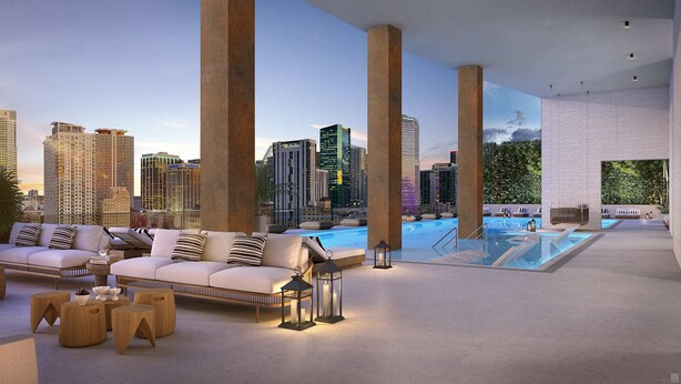 A rooftop lounge with a pool, city skyline views, and modern furnishings. - Downtown Miami Apt: Pool, Skyline Views, Gym Access (Miami)
