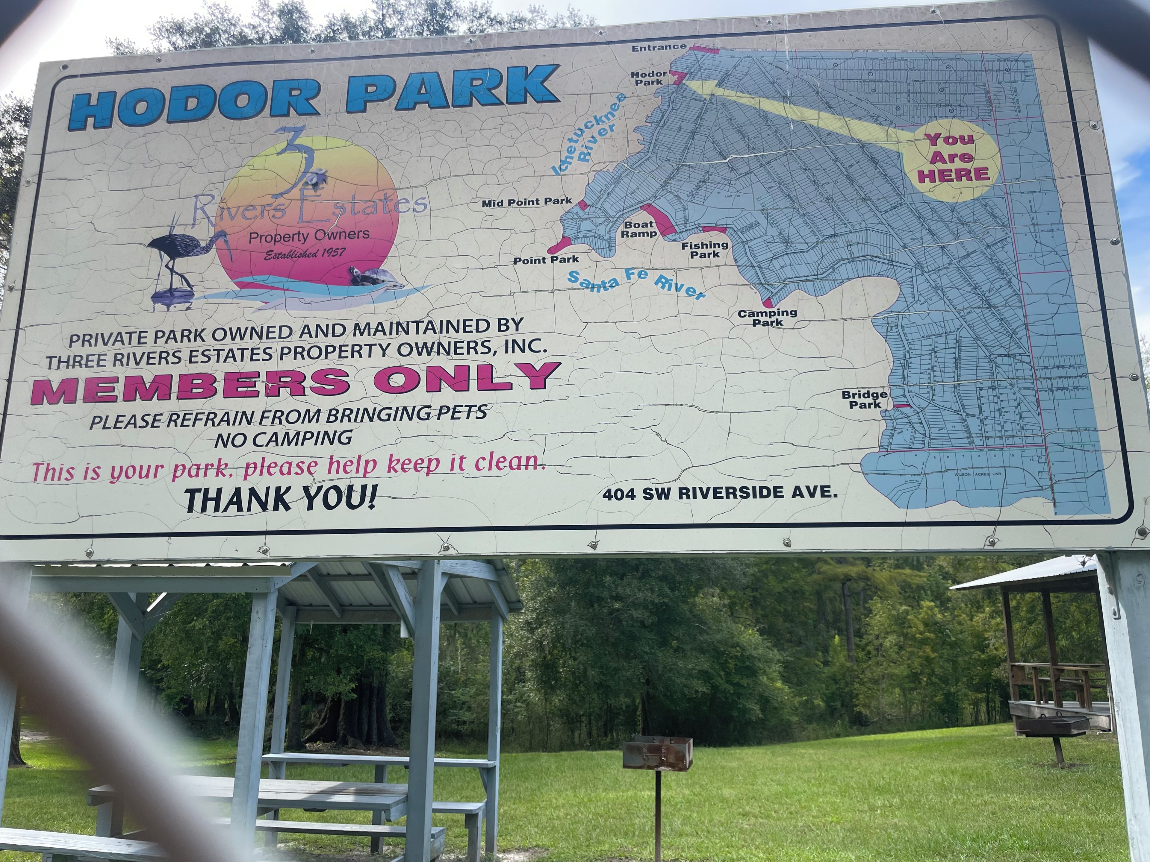 A sign for HODOR PARK with a map and rules for members.