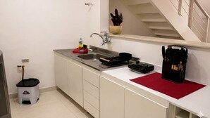 A kitchen with a sink, stove, and countertop. - Apartment just minutes from Copacabana Beach. (Rio de Janeiro)