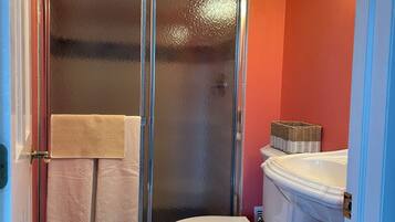 Shower, towels, soap, toilet paper
