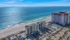 A coastal hotel with multiple high-rise buildings, a beach, and a parking area. - Blue Skies and Gulf Breezes! Enjoy Blue Serenity at LTW Nice Gulf View balcony (Panama City Beach)