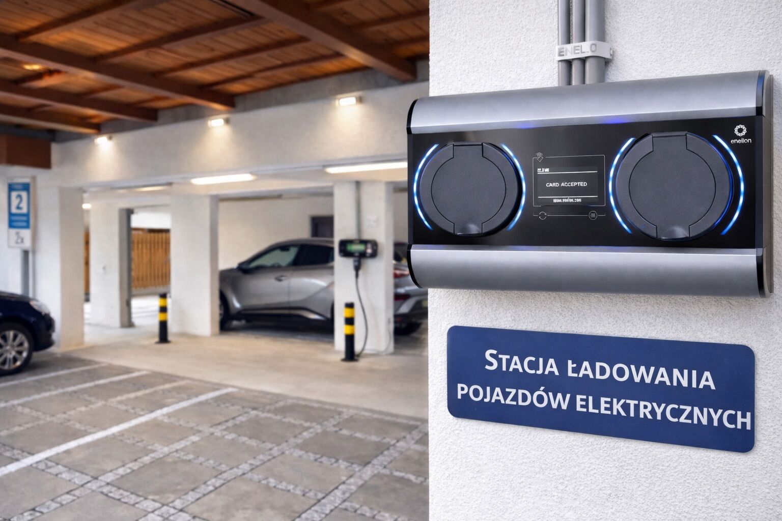 An electric vehicle charging station with a sign indicating it is a public charging point.